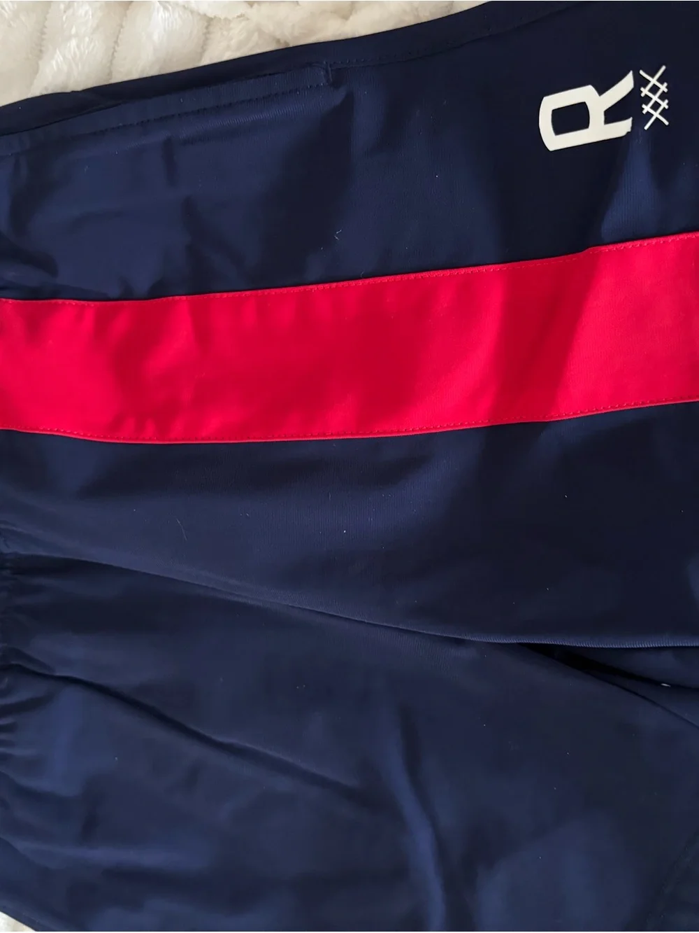 RHONE Navy Blue Kids Swim Trunks with Red Side Panel